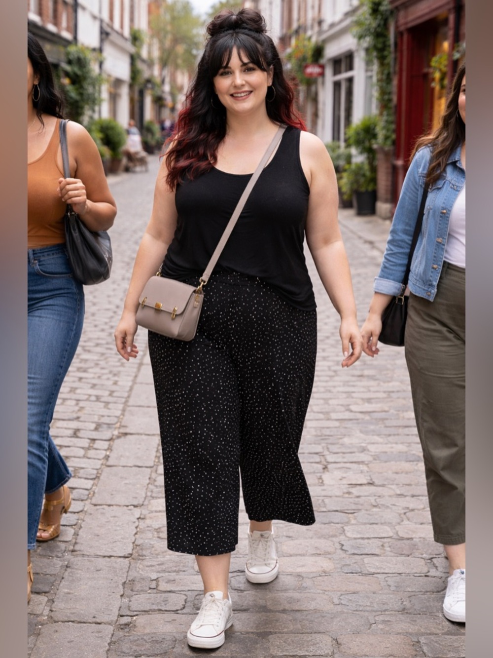 Easy-breezy pull on wide leg Capri pants. A chic black polka dot pattern.